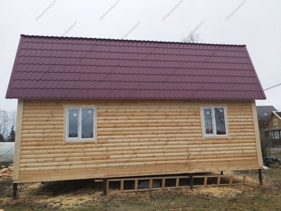 Фото деревянного дома из бруса 6х9 с мансардой